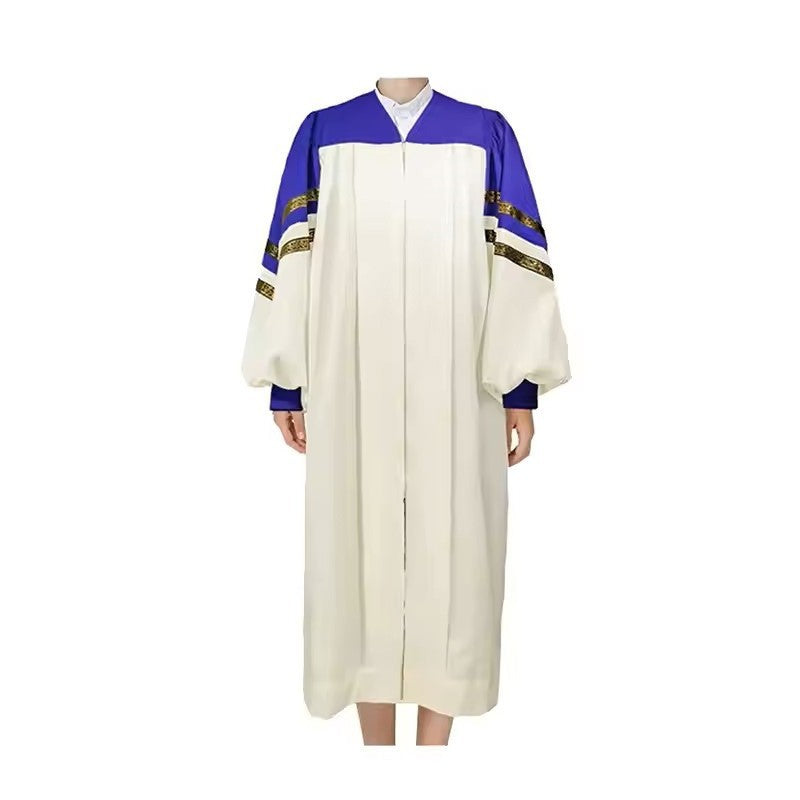 Ivory white choir robe with royal blue shoulder and upper sleeve panel, two diagonal gold brocade trim bands at sleeve junction, puff balloon sleeves with blue cuffed wrists, V-neck zipper, worn on model, white background