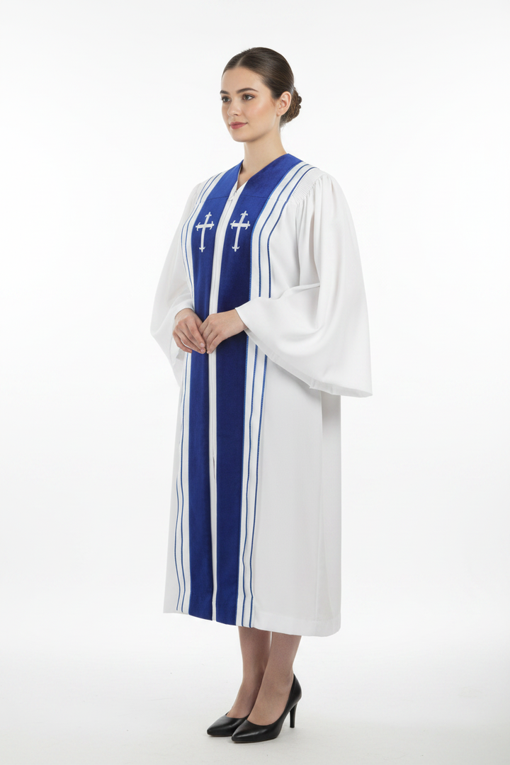 Female model wearing white choir robe with royal blue center stripe and dual white cross badges, full body three-quarter side view, white background