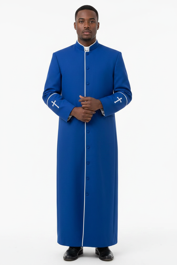 Model wearing full-length royal blue clergy cassock robe with white trim and cross embroidery, white background