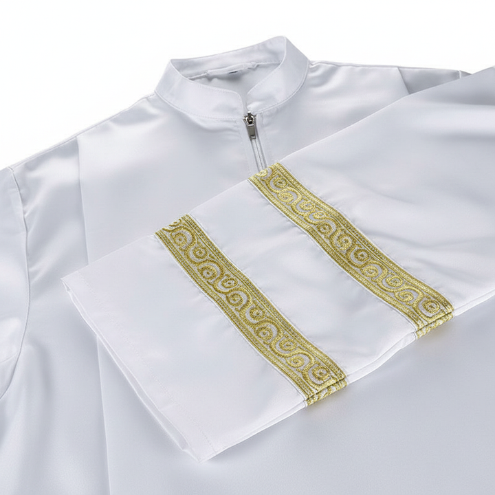 Close-up detail of Style A alb robe showing double gold braid trim at cuff and half-zip collar, white background