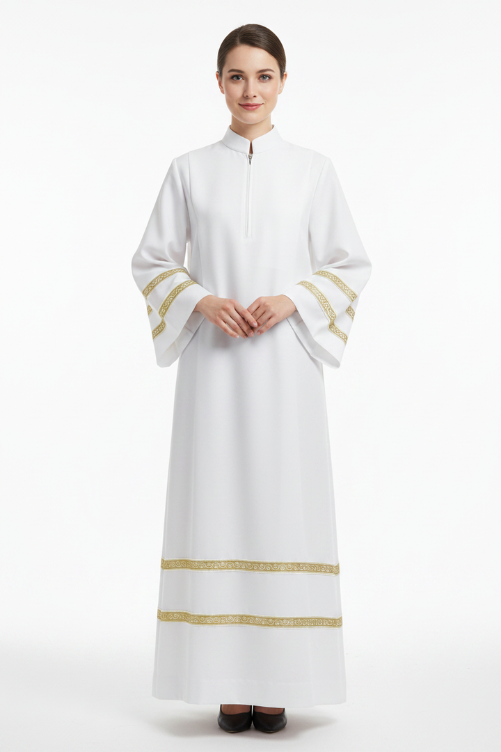 Female model wearing white liturgical choir robe with gold braid trim, full body front view, white background