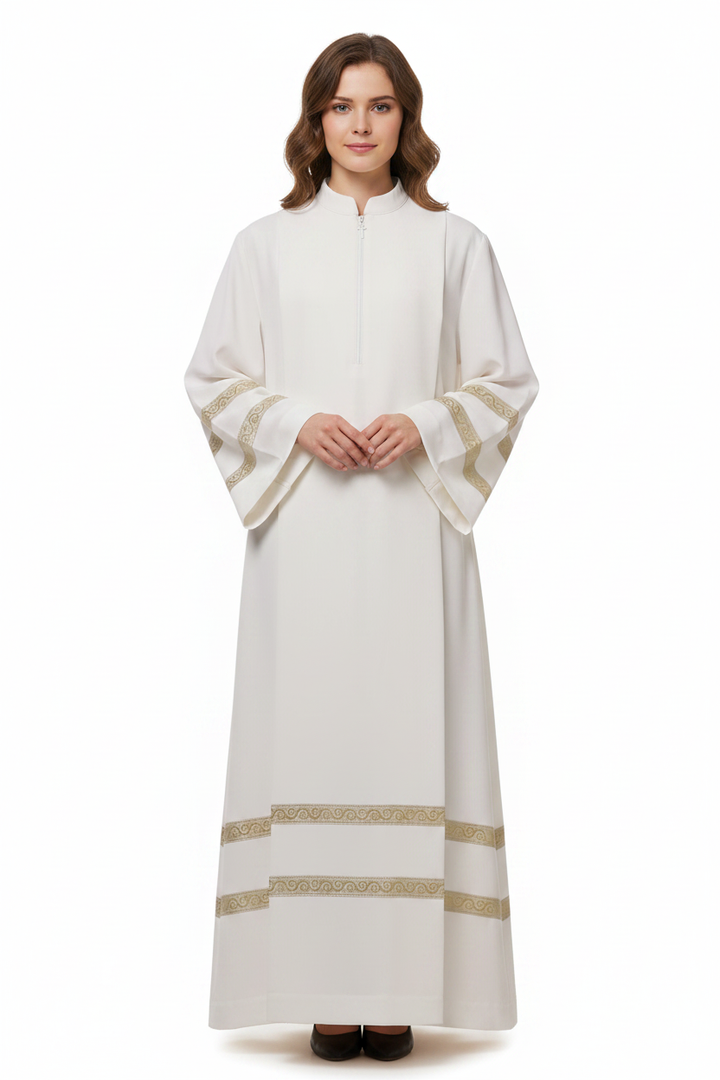 Female model wearing ivory clergy alb robe with double gold brocade trim sleeves and hem, full body front view, white background