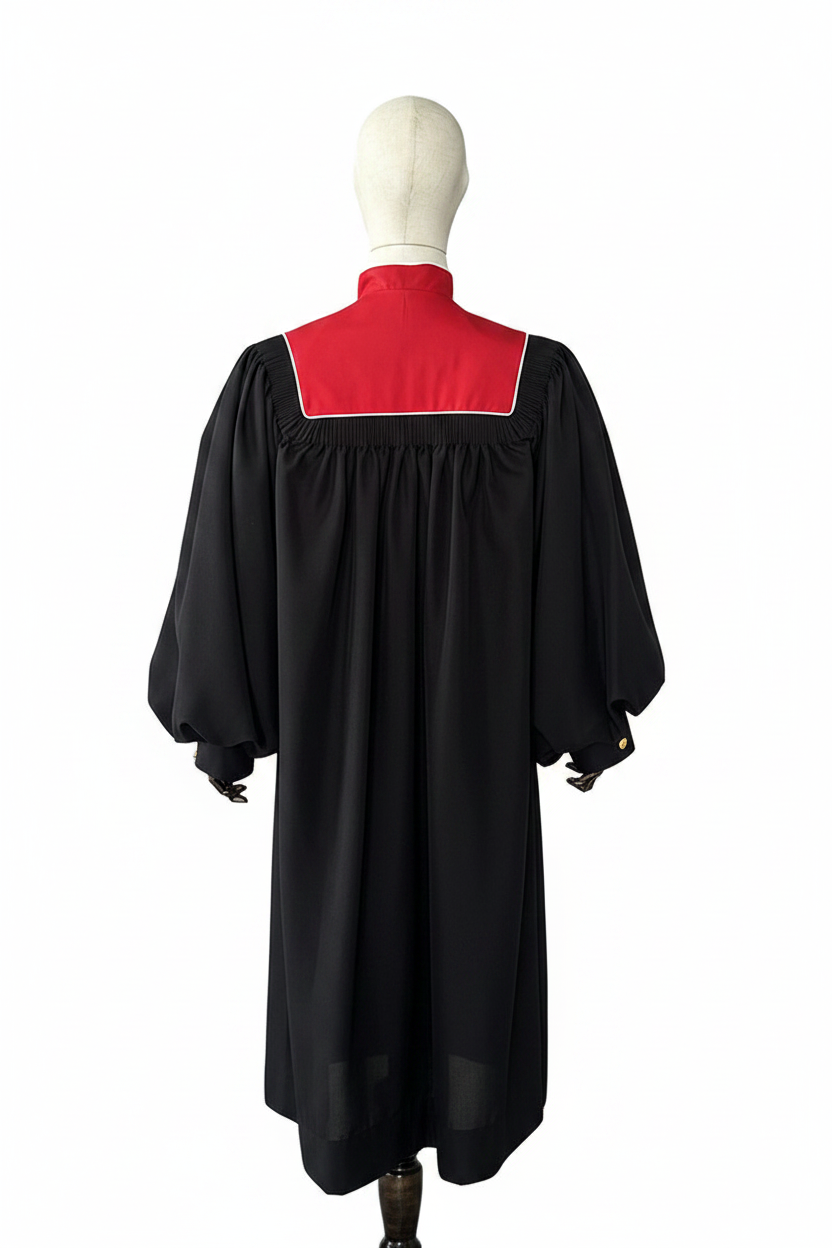 Male model wearing black choir robe with red square yoke back panel and bishop sleeves, back view, white background