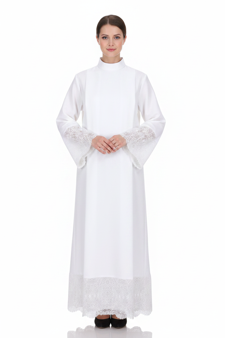 Female model wearing white liturgical alb robe Style D with delicate lace trim and hem border, full body front view, white background