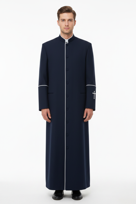 Male model wearing dark navy clergy cassock with white trim and cross embroidery, full body front view, white background
