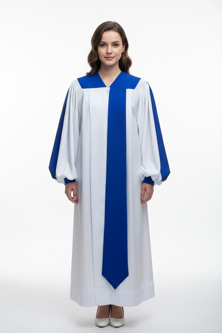 Female model wearing white and royal blue choir robe with puff sleeves, blue yoke collar and center stripe, full body front view, white background
