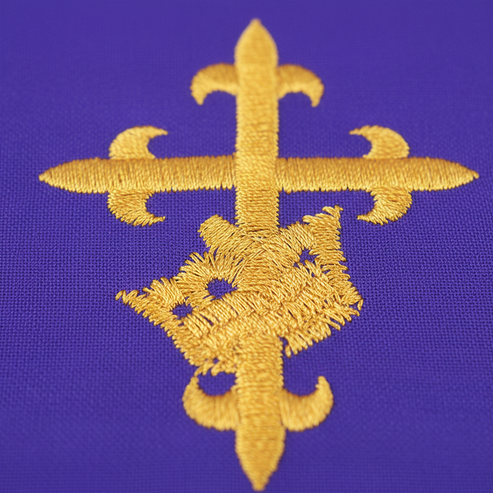 Close-up detail of purple church pulpit scarf showing gold cross embroidery and gold fringe trim, white background