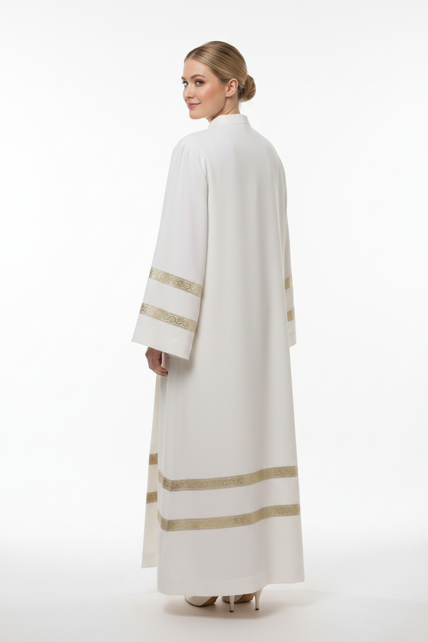 Female model wearing ivory clergy alb robe with double gold brocade trim sleeves and hem, full body back view, white background
