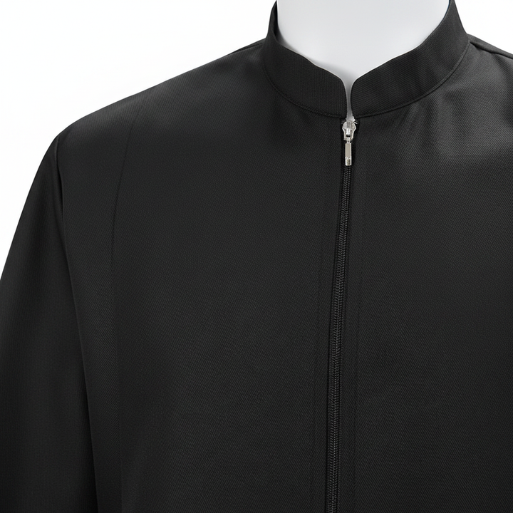 Close-up detail of black choir robe showing stand collar zipper and double gold braid trim on sleeve cuff, white background