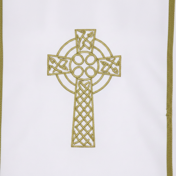 Close-up detail of Style C alb robe showing large gold Celtic cross chest embroidery and vertical gold trim, white background