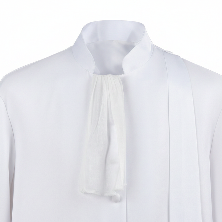 Close-up detail of white medieval barrister robe showing mandarin collar, jabot cravat and button front, white background