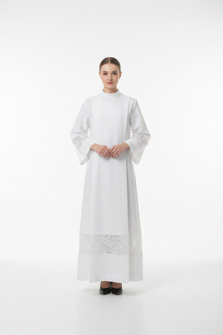 Female model wearing white liturgical alb robe Style B with wide lace panel trim, full body front view, white background