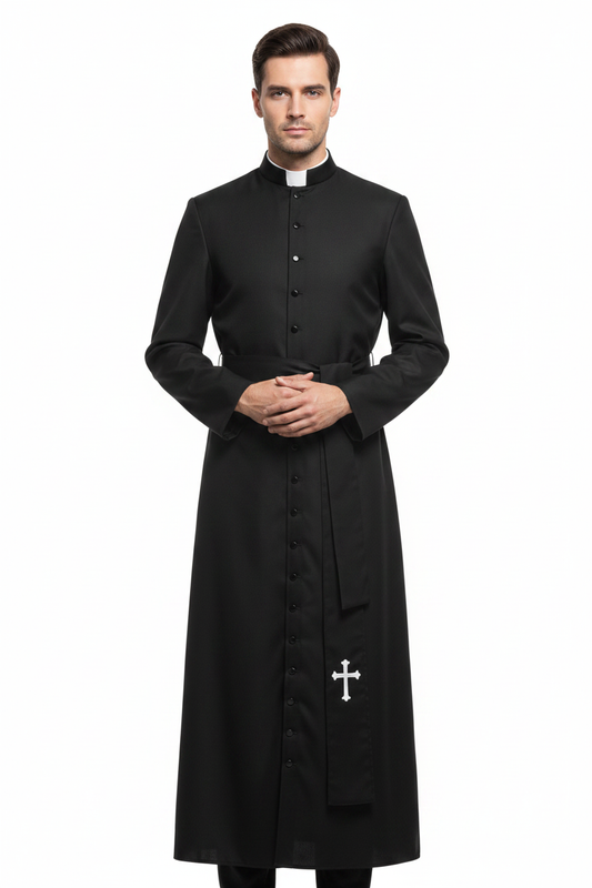 Male model wearing black Catholic cassock robe with white clerical collar and cross embroidery at hem, full body front view, white background