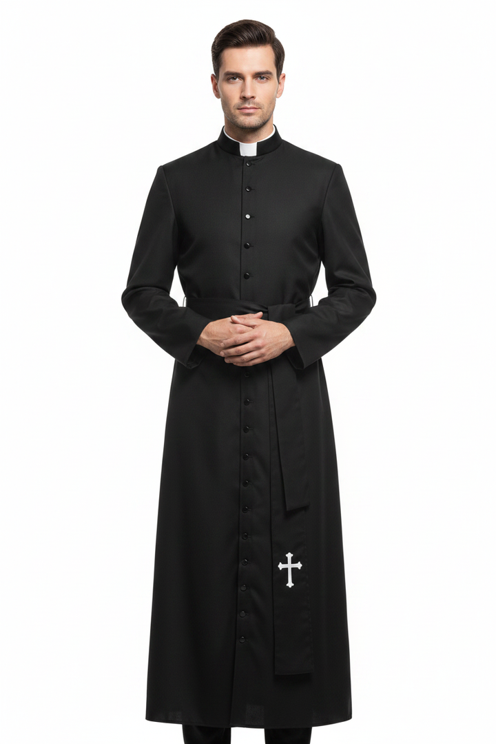 Male model wearing black Catholic cassock robe with white clerical collar and cross embroidery at hem, full body front view, white background