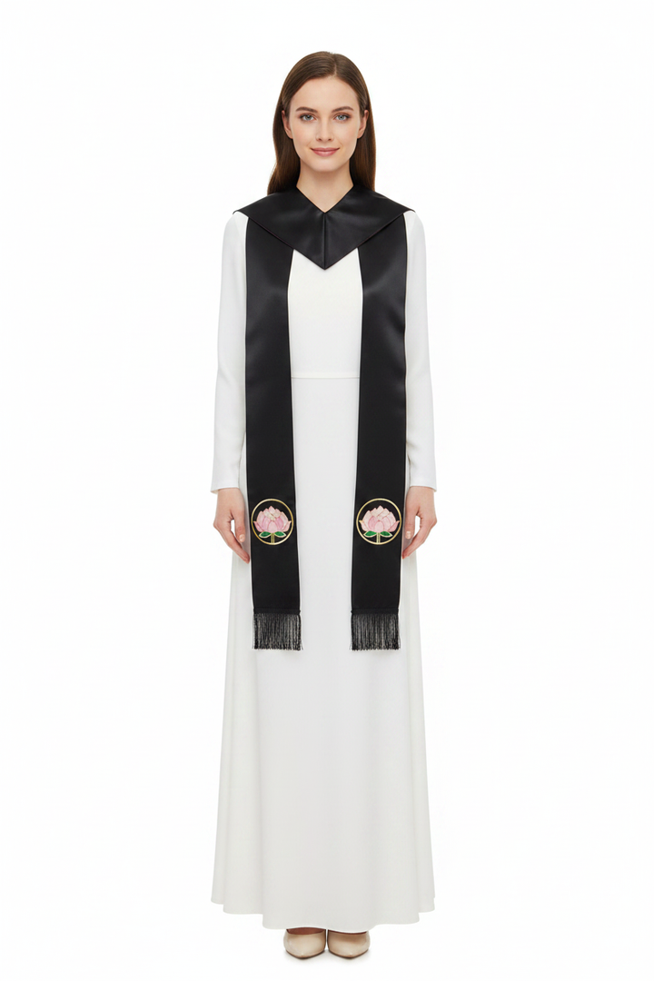 Female model wearing black satin clergy stole with lotus embroidery draped over shoulders, full body front view, white background