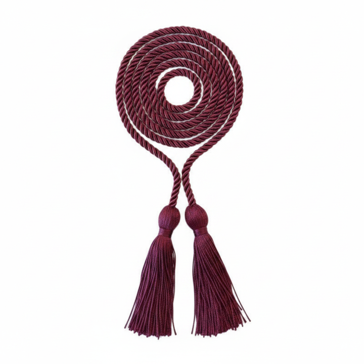 Maroon graduation honor cord flat lay on white background showing full twisted rope and dual tassels