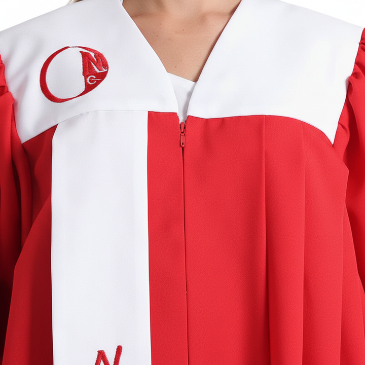 Close-up detail of red choir robe showing white square yoke panel, V-neck zipper, and white front stole with red letter embroidery, white background