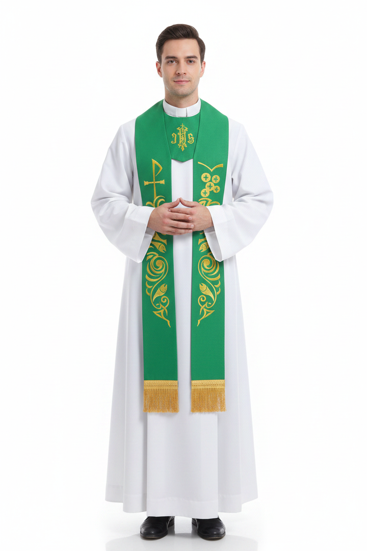 Male priest model wearing white alb robe with green clergy stole showing gold Celtic vine and cross embroidery and IHS emblem, full body front view, white background