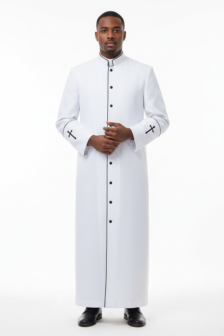 Model wearing full-length white clergy cassock robe with black trim and cross embroidery, white background