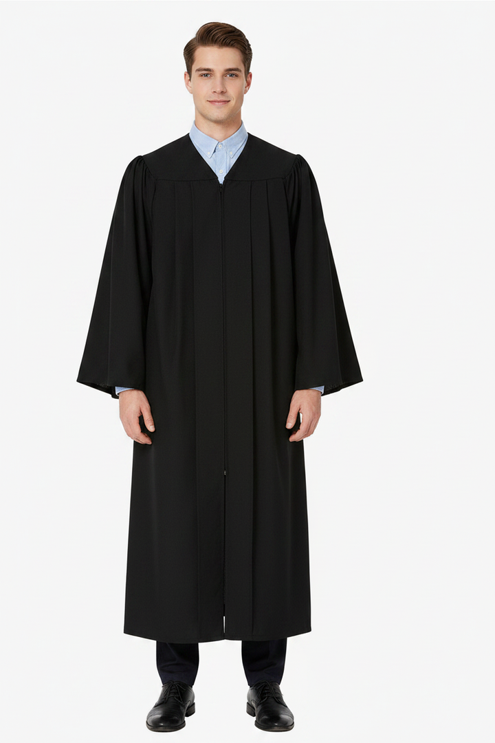 Male model wearing economy black master graduation gown with Tudor-style closed sleeves, white background