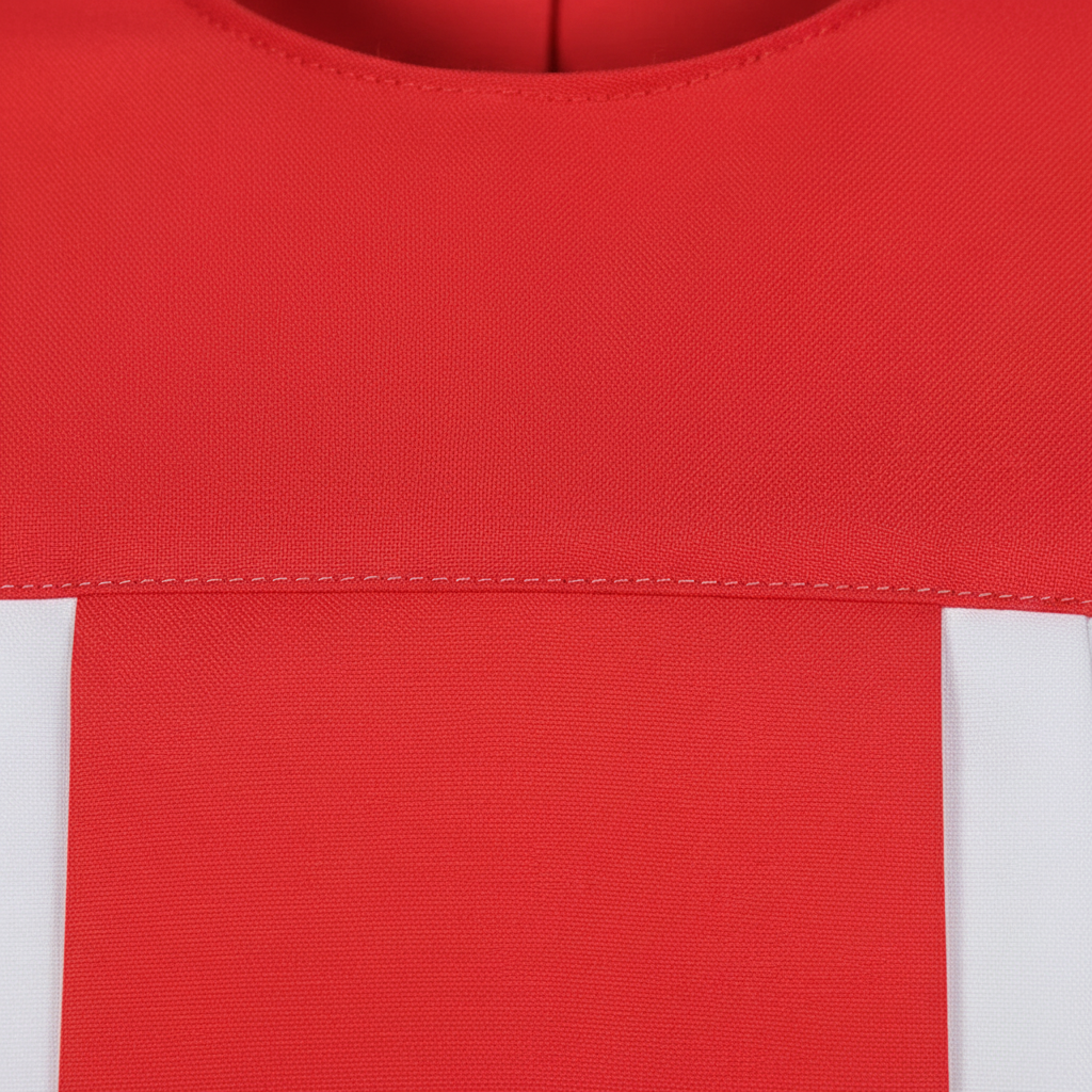 Close-up detail of choir robe showing red round neckline and wide center front panel over white fabric, macro shot, white background