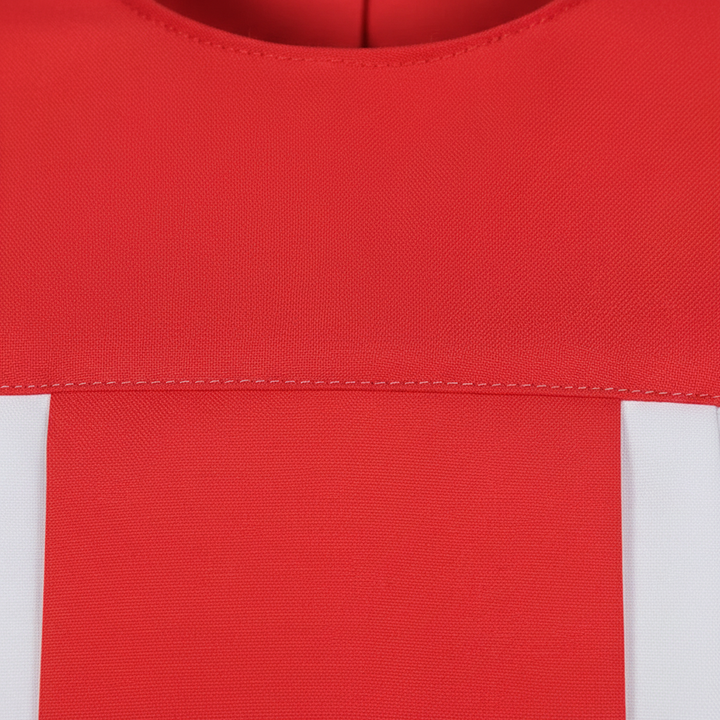 Close-up detail of choir robe showing red round neckline and wide center front panel over white fabric, macro shot, white background
