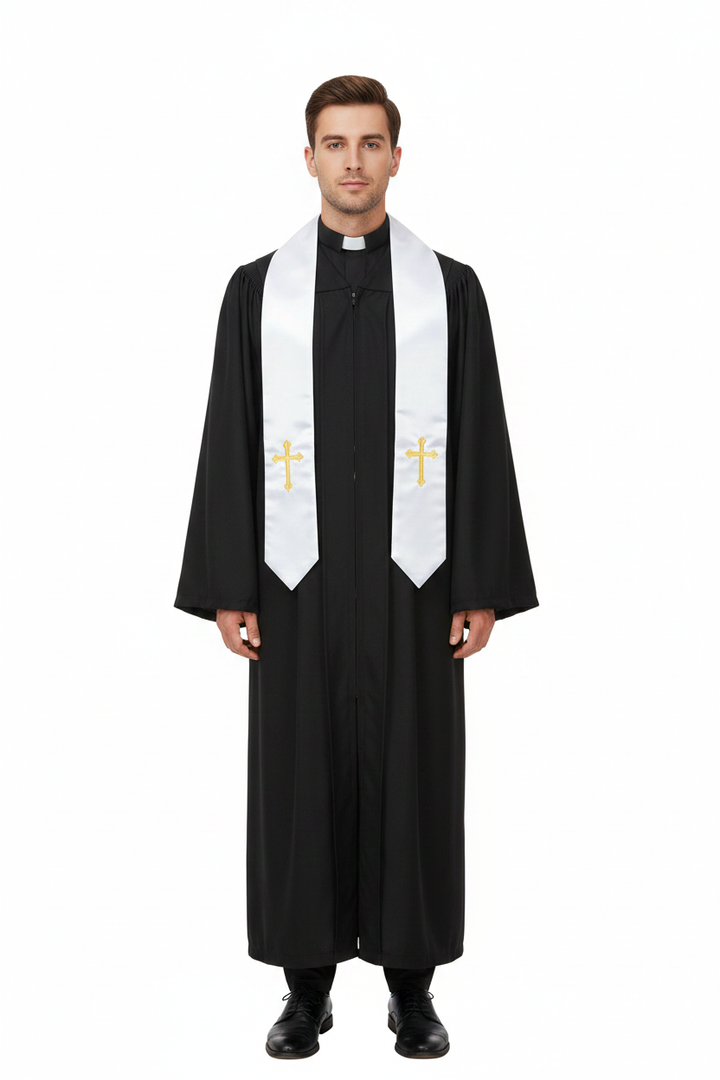 Male model wearing black clergy robe with white satin gold cross stole, full body front view, white background