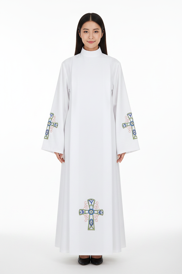 Female model wearing white liturgical alb robe Style E with colorful Celtic cross embroidery, full body front view, white background