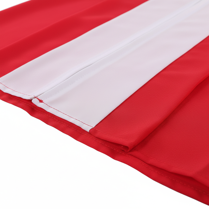 Close-up detail of red choir robe showing clean finished hem at bottom with red and white contrast, white background