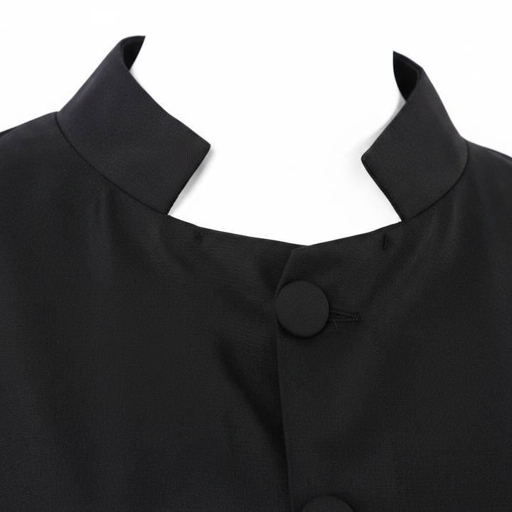 Close-up detail of black inner wear robe showing stand collar neckline and front button closure row, white background