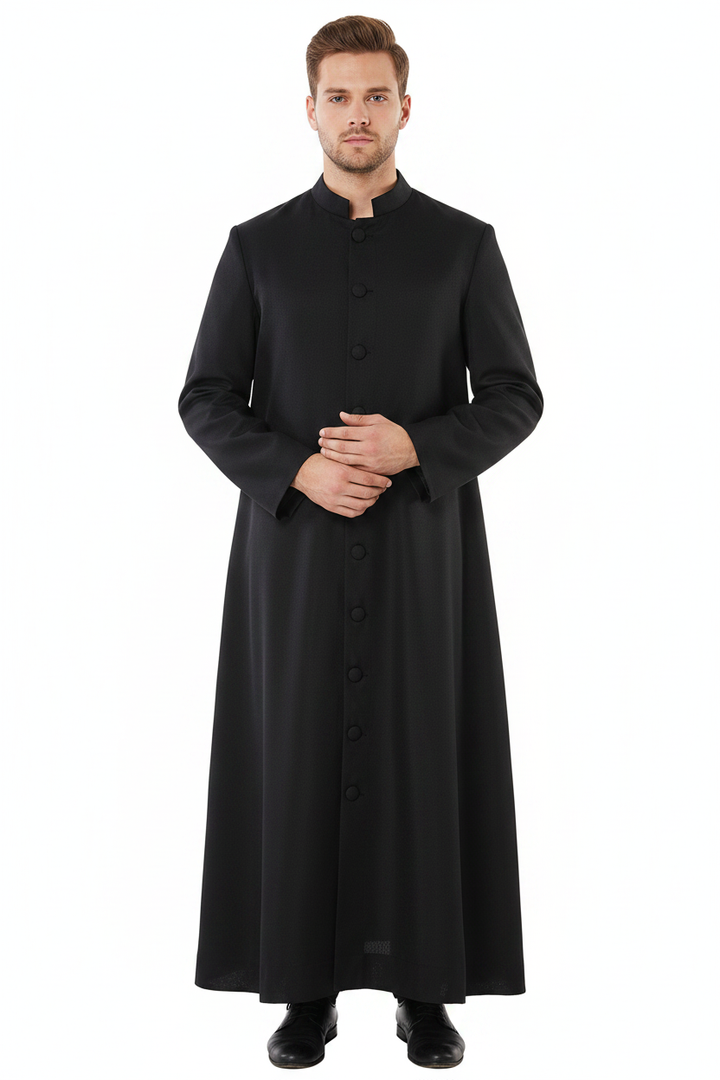 Male model wearing black stand collar cassock robe with single button front, full body front view, white background