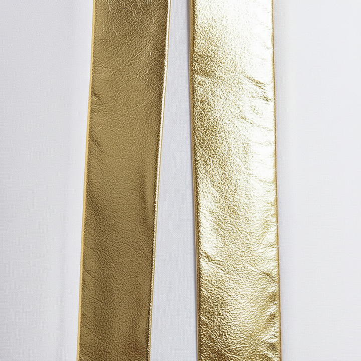 Close-up detail of white choir robe metallic gold center front stripe panel, macro shot, white background