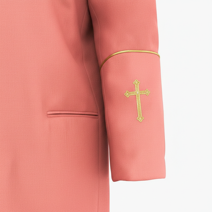 Close-up detail of red clergy cassock robe cuff with gold cross embroidery and gold piping trim