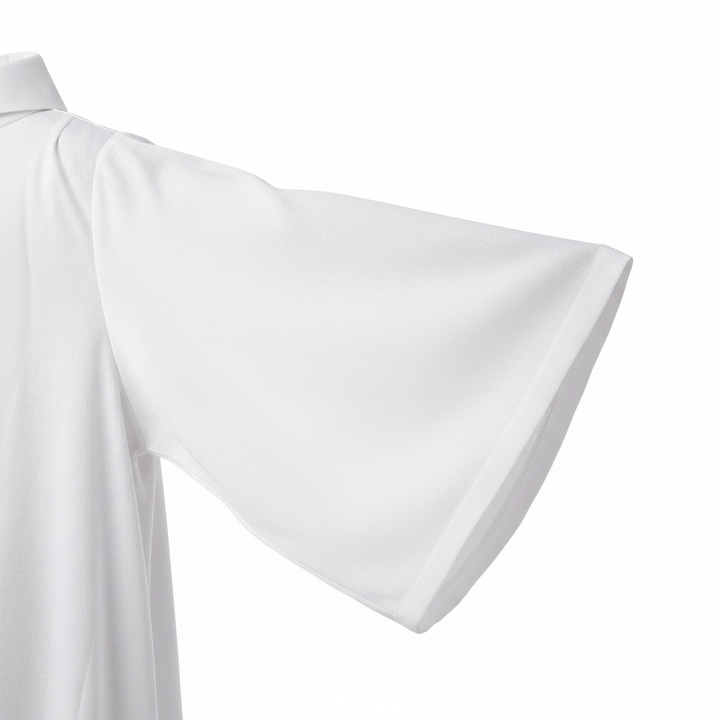 Close-up detail of white alb robe showing wide bat-wing sleeve drape and white fabric texture, white background
