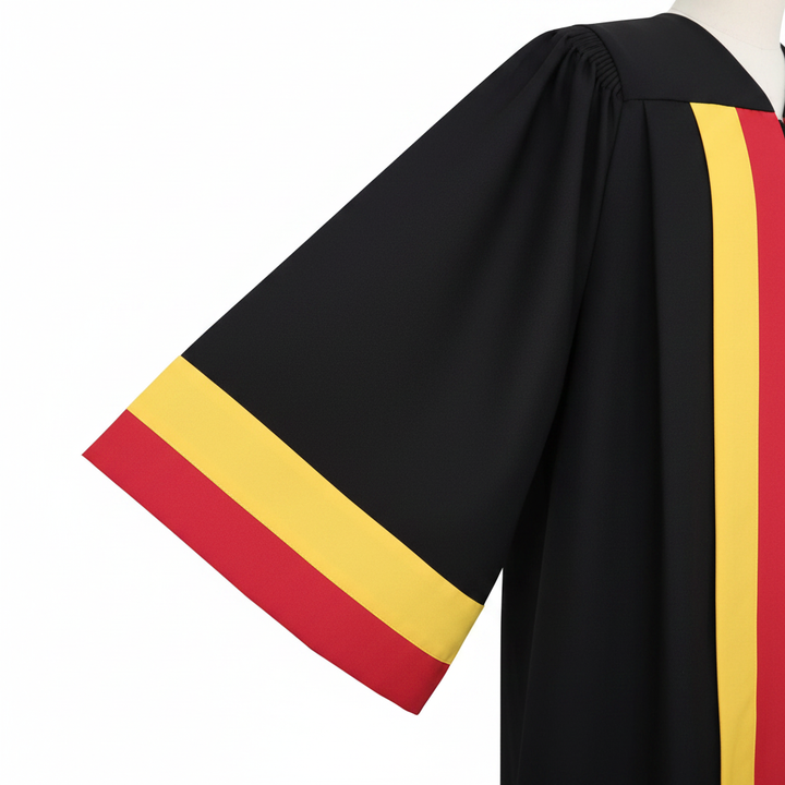 Close-up detail of black choir robe showing wide flowing sleeve with red and gold band trim at the cuff, macro shot, white background